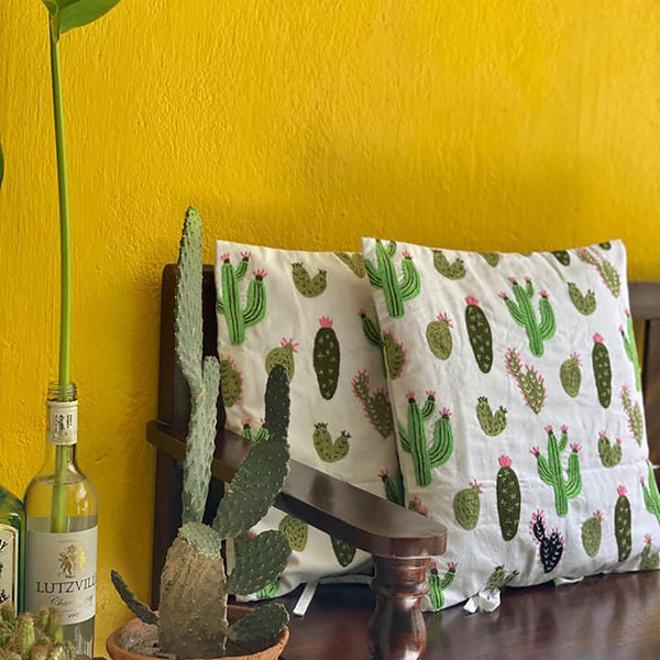 Embroidered Cactus cushions, against beautiful yellow background