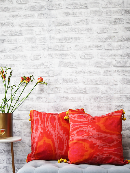Gulmohar, Orange Raw Silk Ikat Cushion Covers with yellow tassels