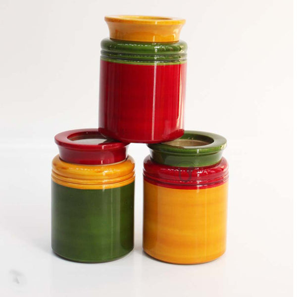 red, yellow and green jars with mixed colour lids