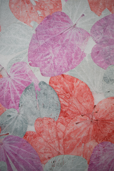 leaf details of black bordered poster with purple, orange and shades of grey imprinted leaves