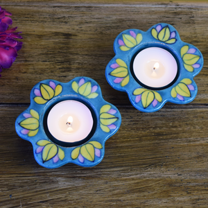 Blue diyas with yellow and pink lotuses
