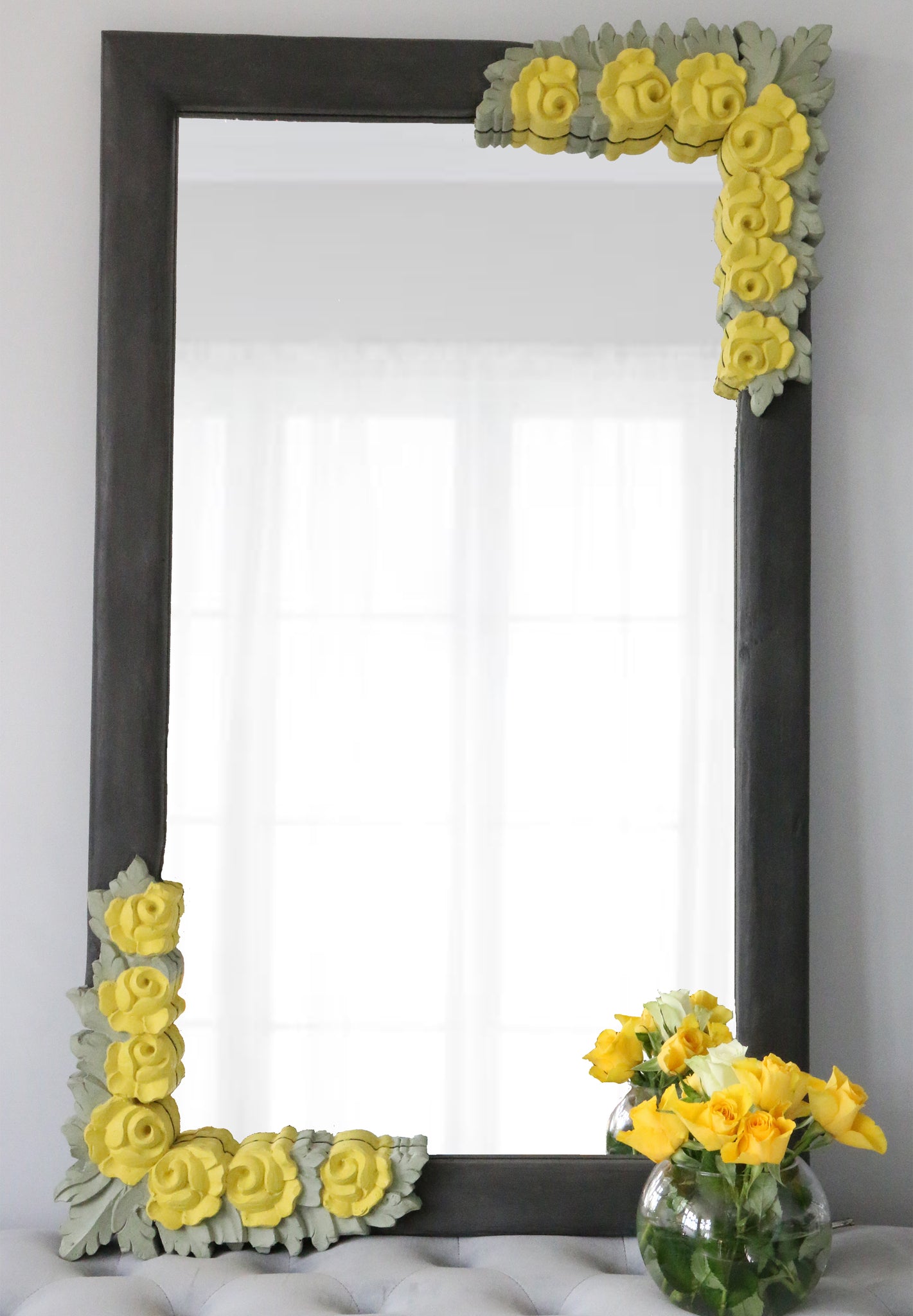 front image of charcoal frame with corner yellow flowers and olive green leaves