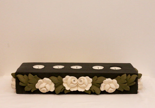 Charcoal base with all around white flowers and olive green leaves, front view