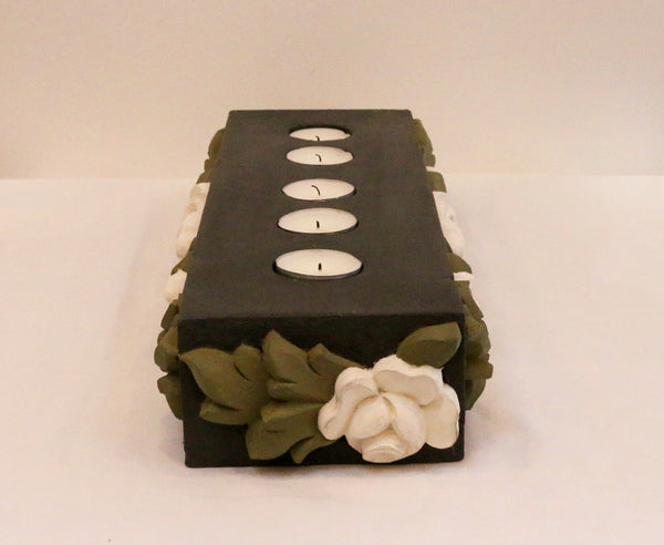 Charcoal base with all around white flowers and olive green leaves, side view
