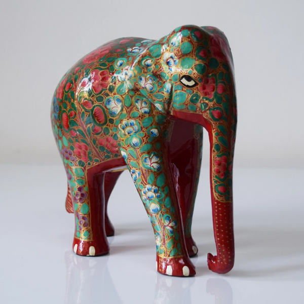Red elephant with multicoloured floral motifs- side view