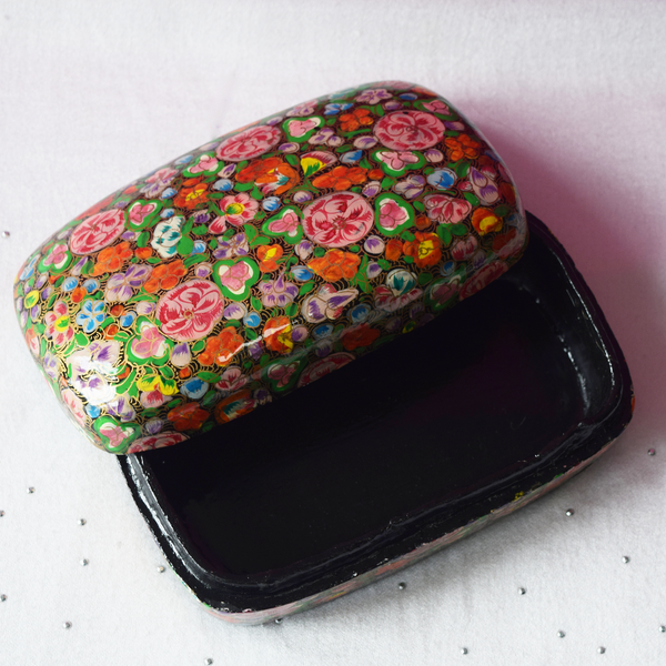 Multicoloured floral paper mache box open with black interior