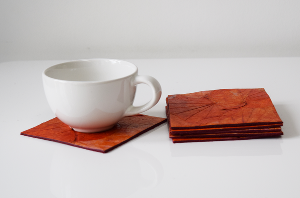 Orange handmade paper coasters with cup