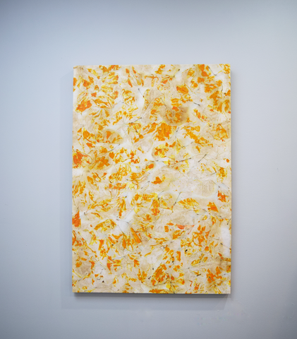 White poster with orange and yellow leaf imprints
