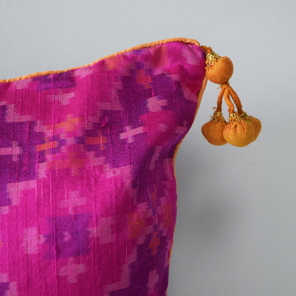 Gulabi Silk IKat Cushion Cover with mustard pompoms on edges