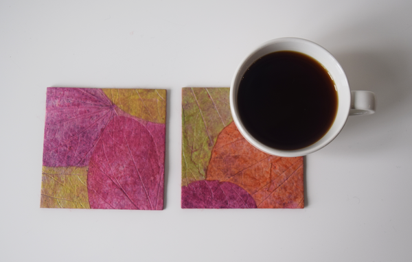 pink, green and purple coasters with cup