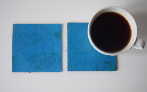 turquoise coasters with benjamin leaf imprint- with cup