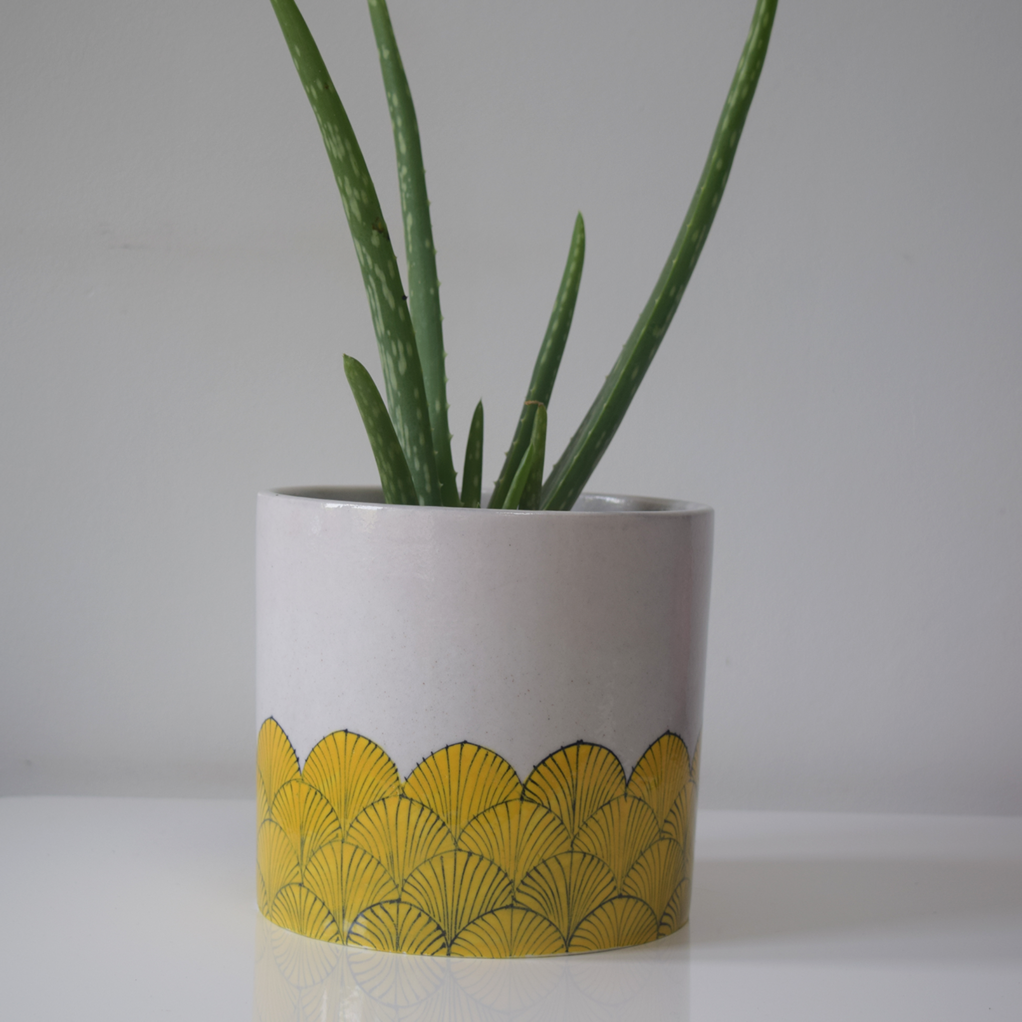 pankha, yellow and white fan patterned planter