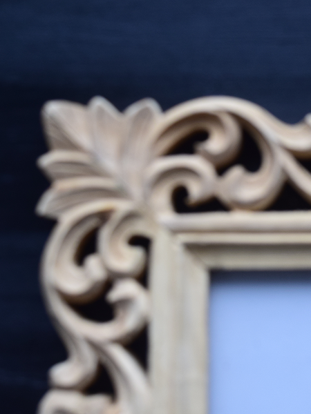 carved details of wooden frame