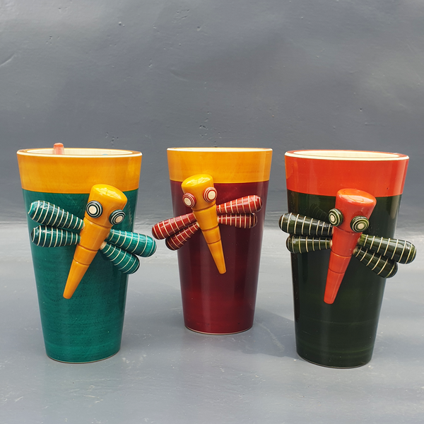 red-yellow, green-yellow and orange-green dragon-fly pen stands