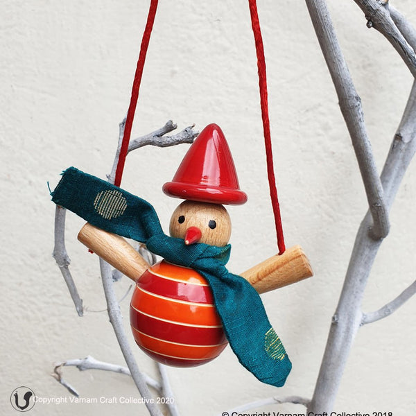 orange snowman on a swing ornament