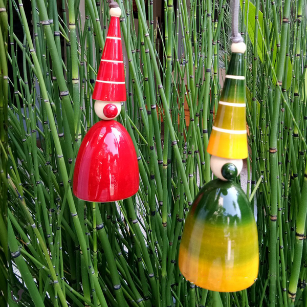 red and green-yellow wooden gnome bells