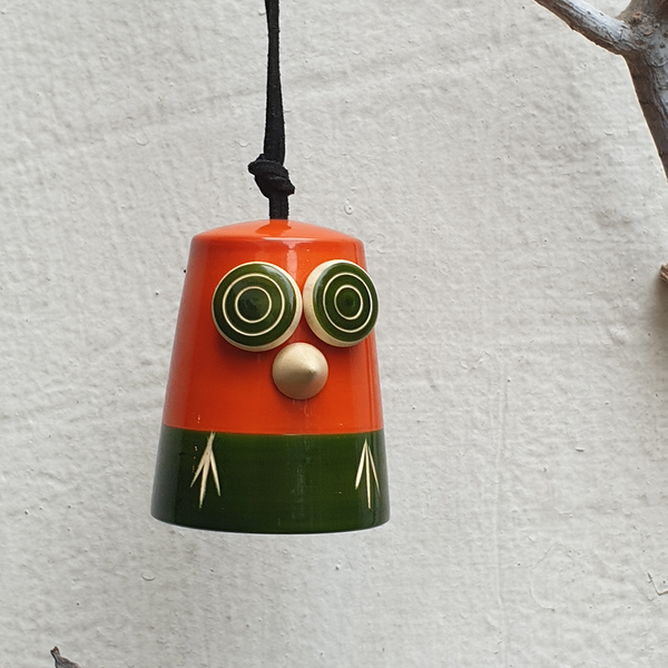 orange-green wooden owl bell