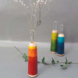 red-orange wooden test tube vase