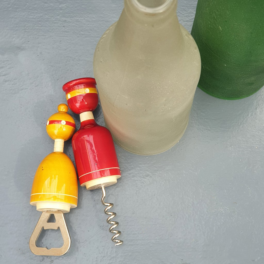red and yellow wooden cork and bottle openers