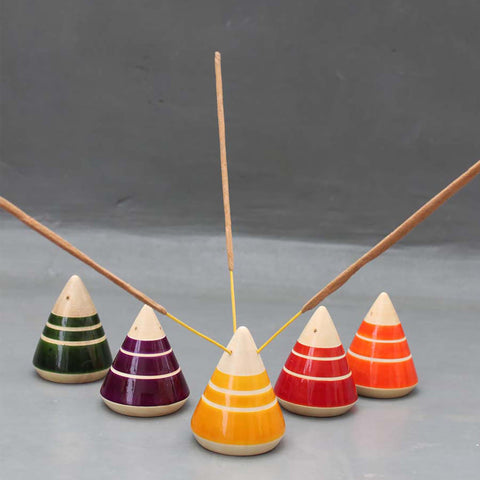 red, yellow, green, purple and orange wooden incense holders